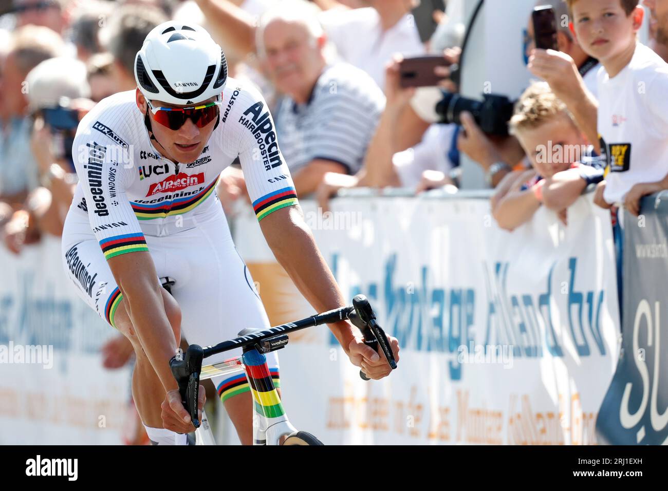 ETTEN-LEUR - World champion Mathieu van der Poel during the Pro Cycling  Tour Etten-Leur. Van der Poel shows for the first time his rainbow jersey  that he won during the World Cycling