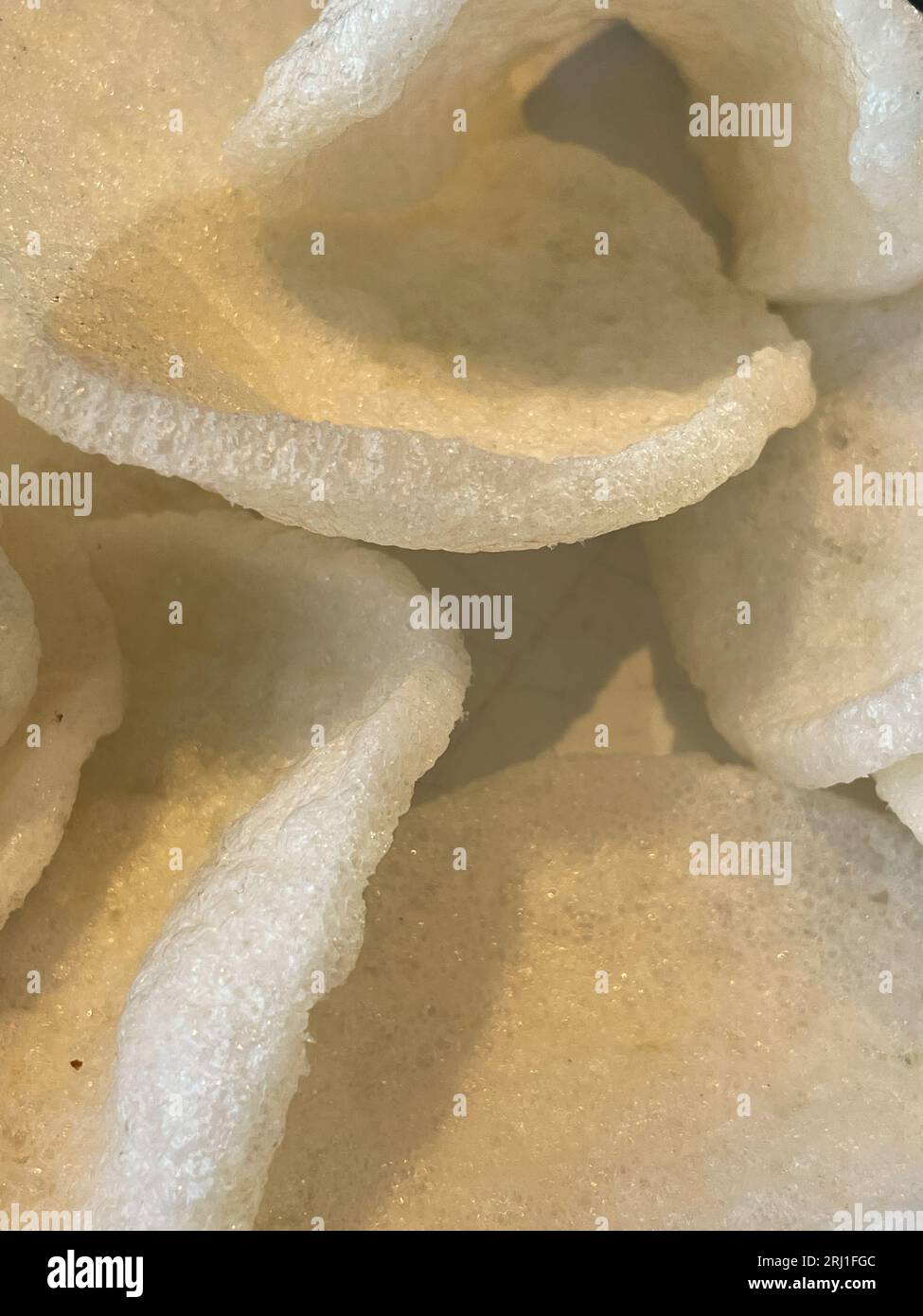 Kerupuk Udang or Prawn crackers are made from tapioca flour and finely ground shrimp mixed with herbs and flavor enhancers. Stock Photo