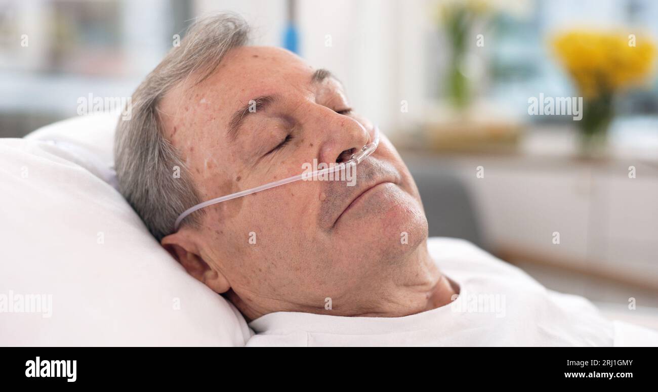Oxygen, hospital bed and senior man sleeping with ventilation and