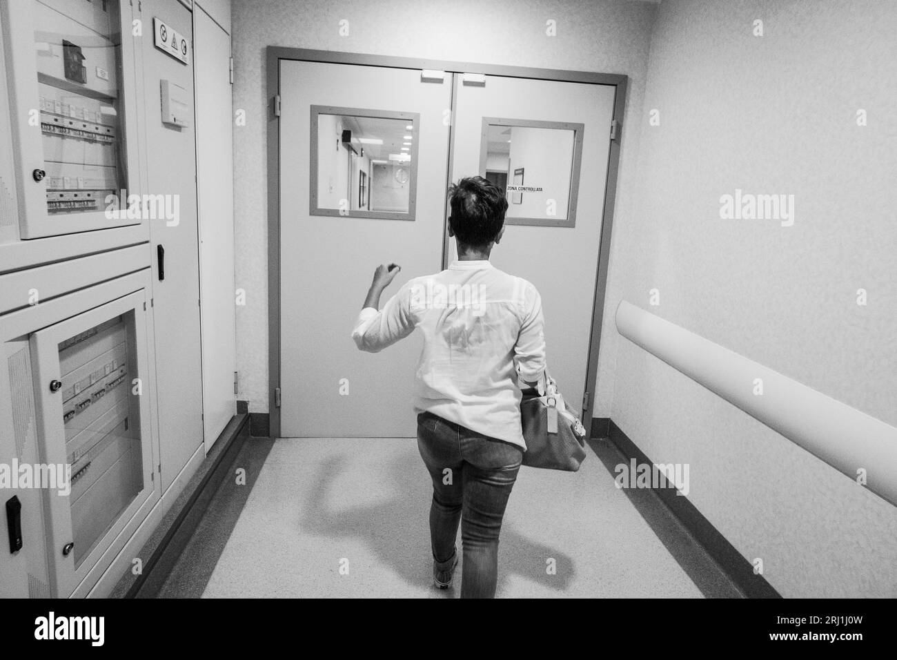 Italy, Milan, European Oncology Institute,  Betty leaves the radiology department after medical checkups. Stock Photo
