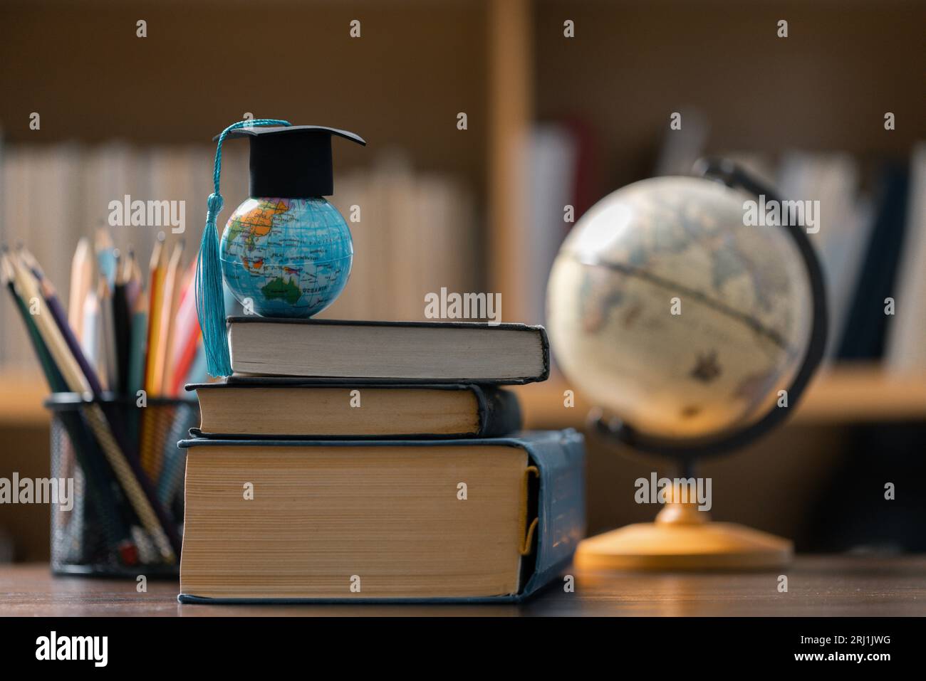 Graduation cap with Earth globe. Concept of global business study