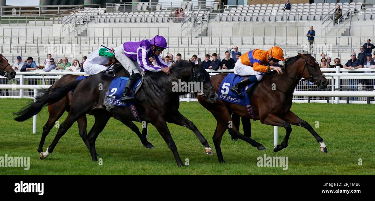 Asean ridden by Gavin Ryan (right) on their way to winning the Qatar Racing And Equestrian Club Irish EBF Curragh Stakes at Curragh Racecourse, County Kildare. Picture date: Sunday August 20, 2023. Stock Photo