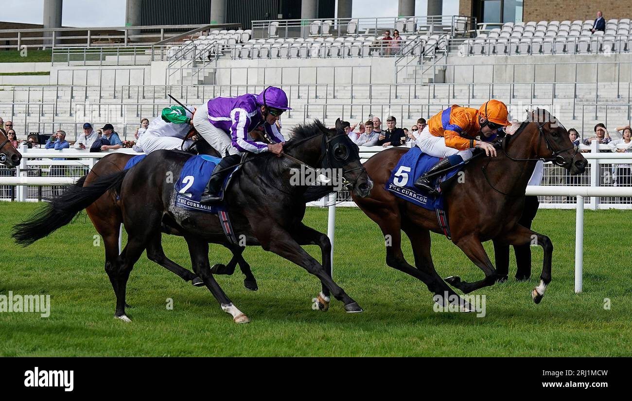 Asean ridden by Gavin Ryan (right) on their way to winning the Qatar Racing And Equestrian Club Irish EBF Curragh Stakes at Curragh Racecourse, County Kildare. Picture date: Sunday August 20, 2023. Stock Photo