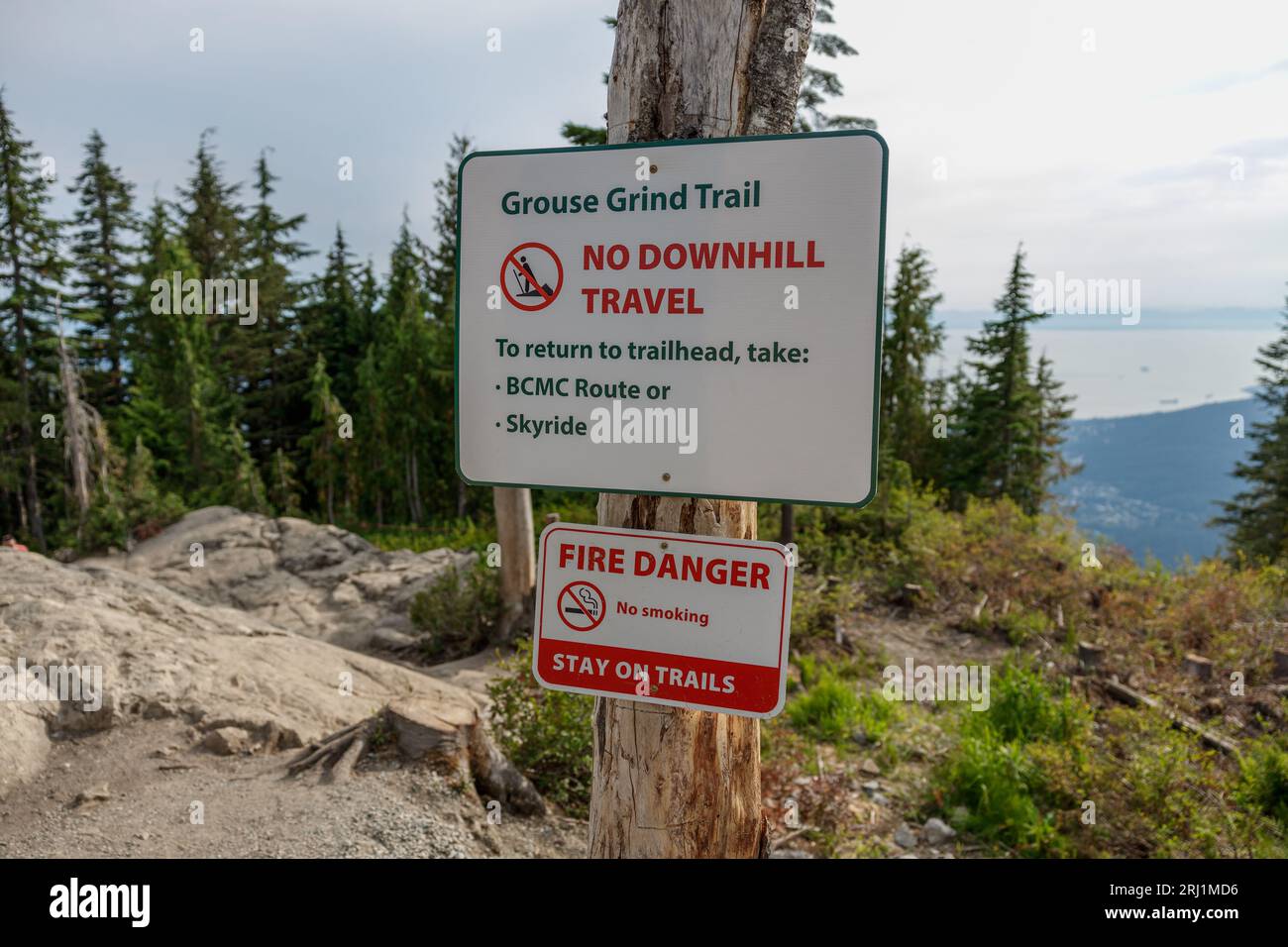View of a warning sign along the Grouse Grind Trail in Vancouver indicating that downhill travel is prohibited Stock Photo