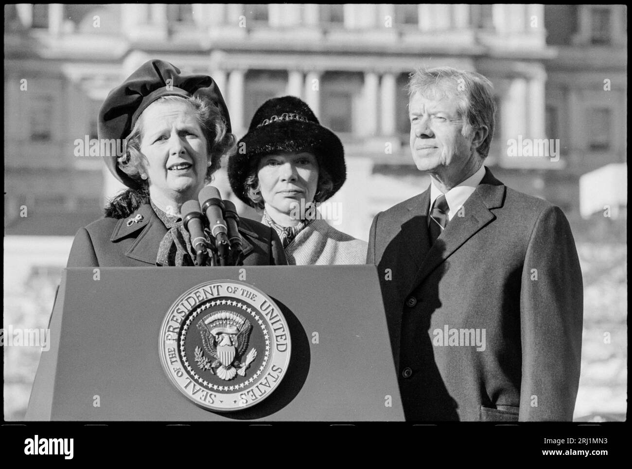 Prime Minister of Great Britain, Margaret Thatcher, speaking at a lectern, next to President of US Jimmy Carter and First Lady Rosalynn Carter.  In Washington, D.C.  17 December 1979. Stock Photo