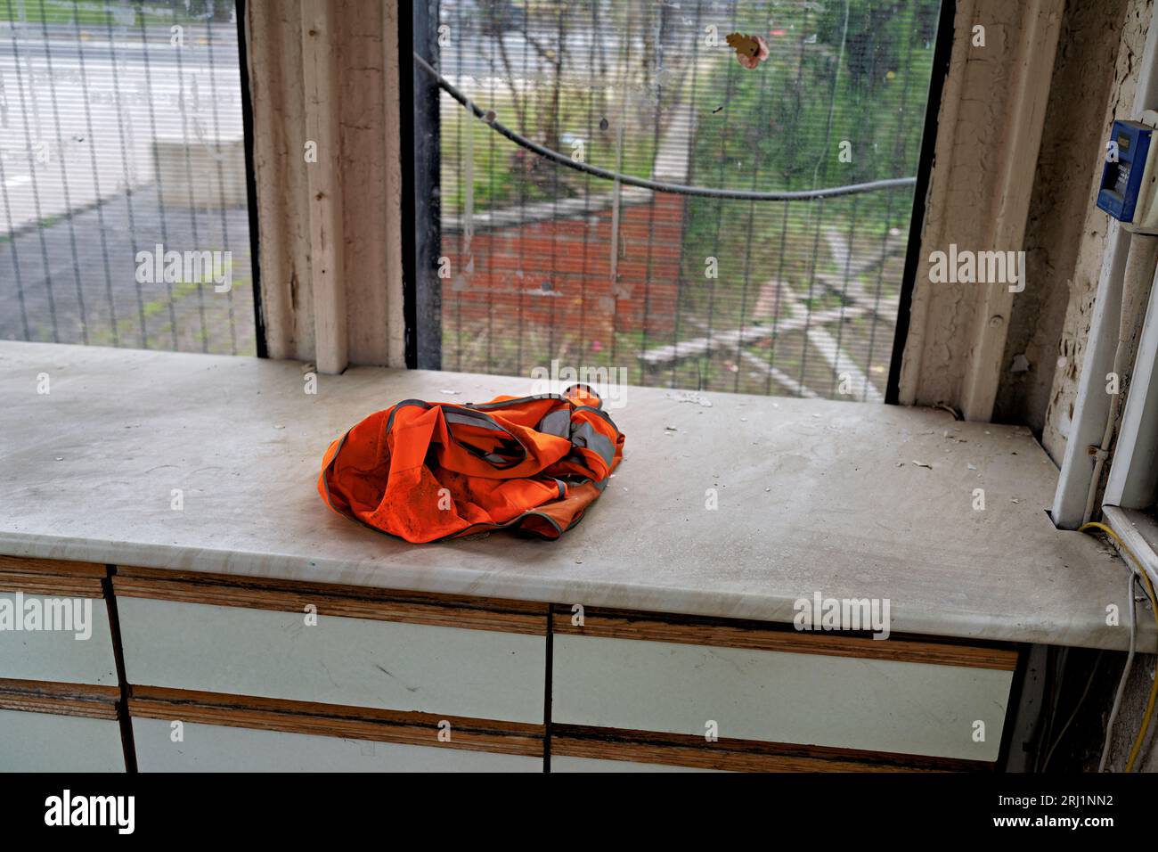 high visibility jacket left in the unused site office Stock Photo