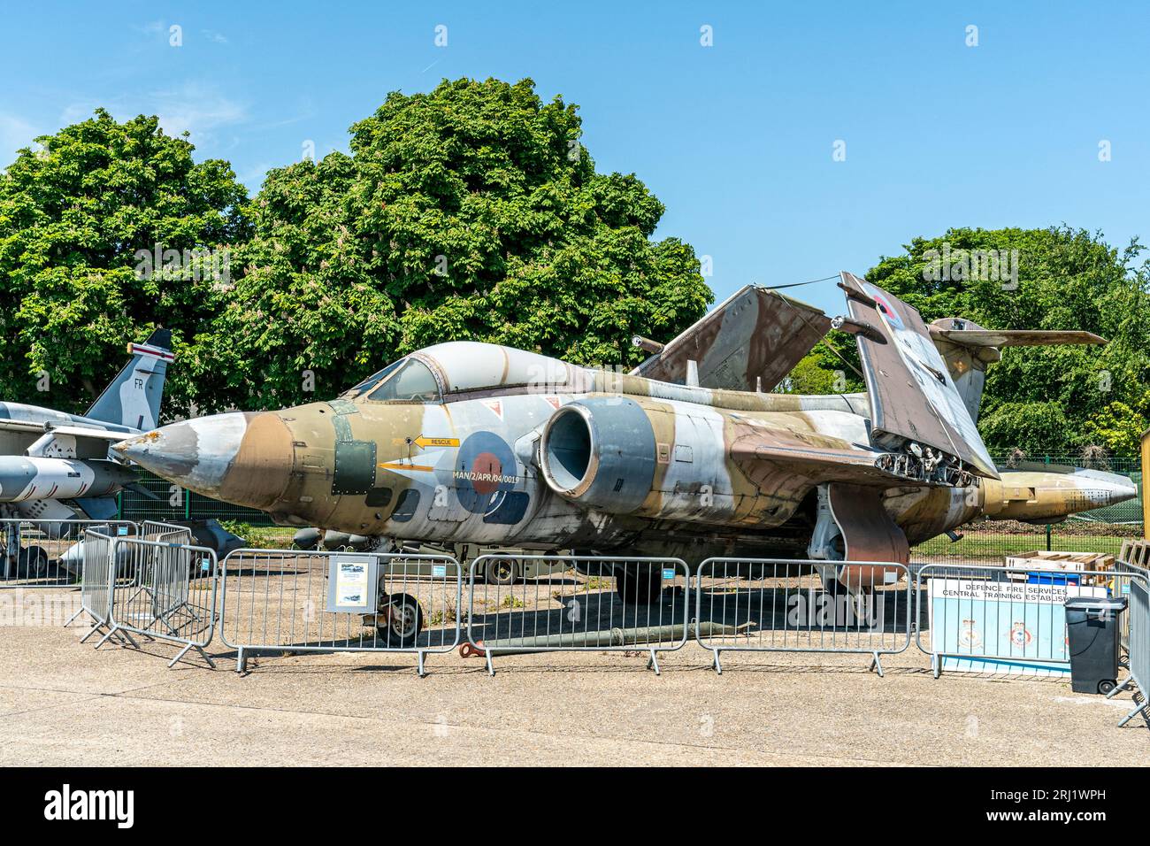 RAF fighter bomber Blackburn Buccaneer, with its wings folded, on display outside at the RAF Manston History Museum in Kent. Summertime, blue sky. Stock Photo