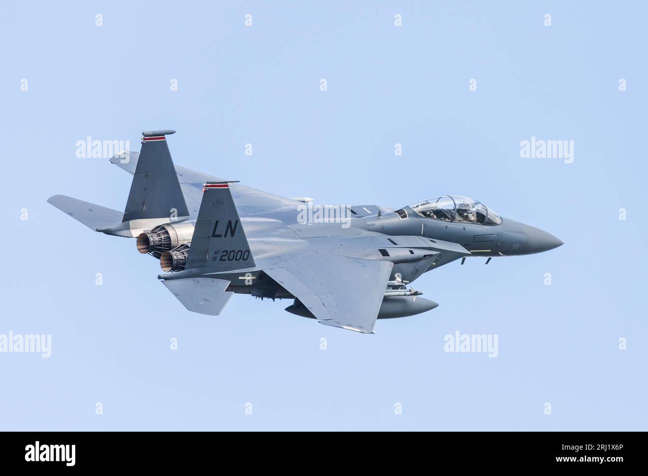 An F-15E Strike Eagle from the 494th Fighter Squadron at RAF Lakenheath in Suffolk banks after take off from it's USAF air base in August 2023. Stock Photo