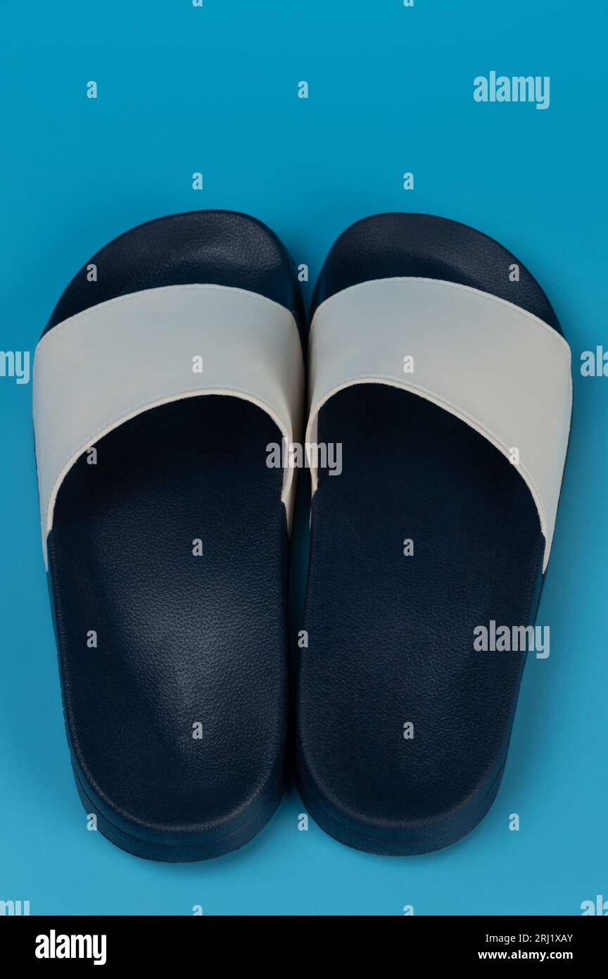 Pair of blue plastic flipflops back view isolated Stock Photo - Alamy