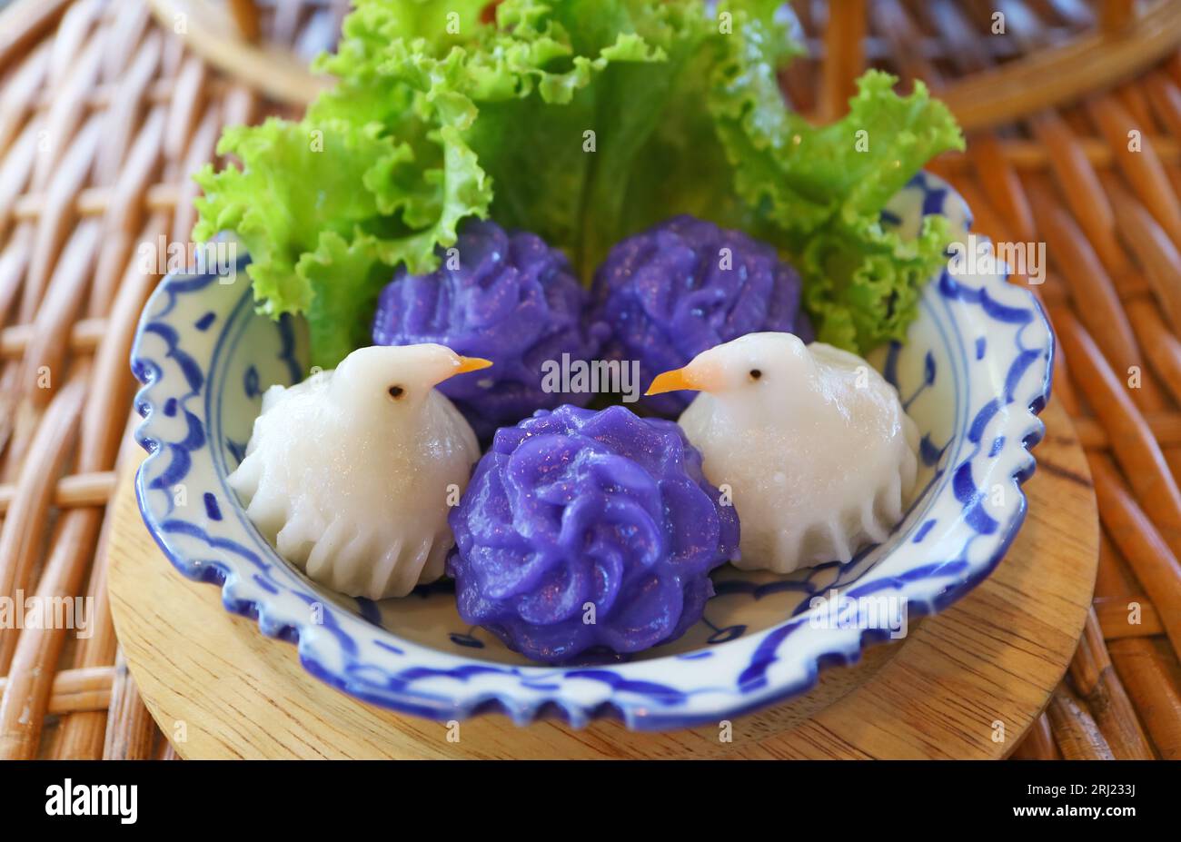 Thai Style Bird Shaped Dumplings Called JEEB NOK with Flower Shaped Dumplings Called CHOR MUANG Stock Photo