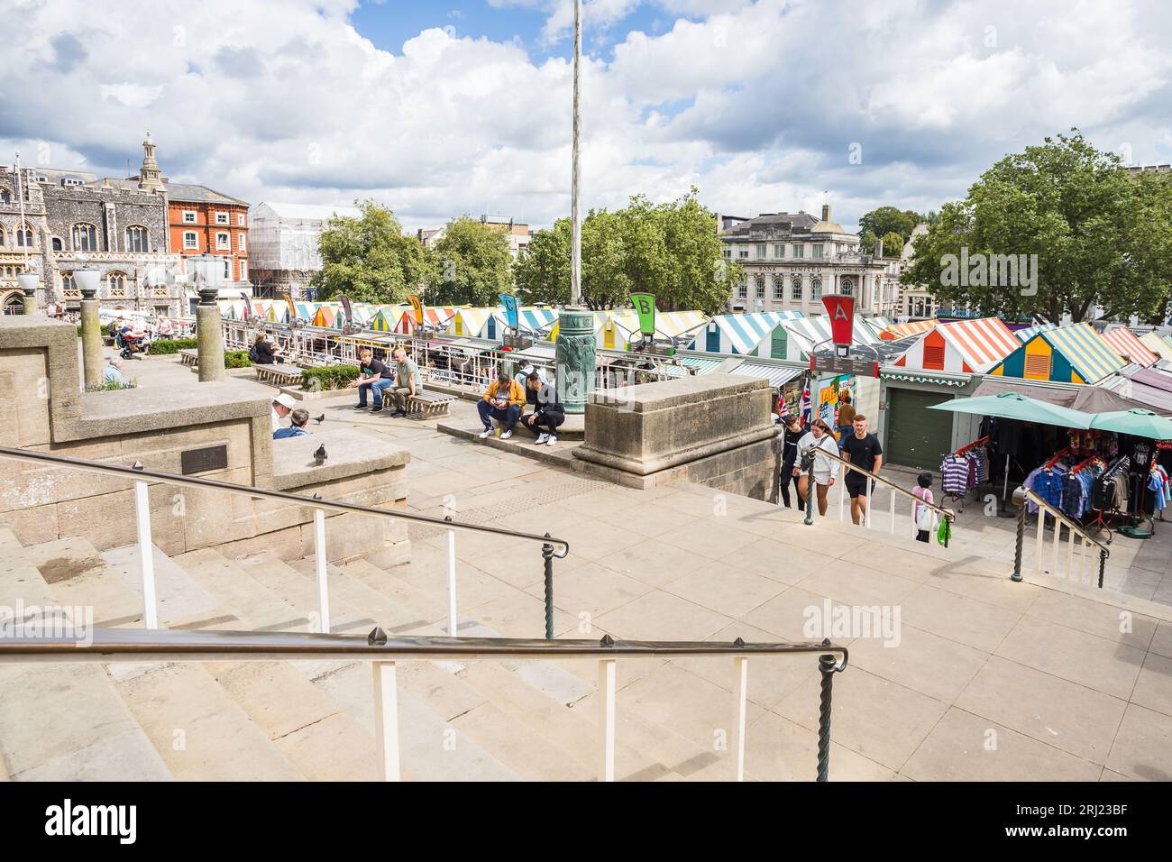 Norwich market seen under the steps and railings pictured from St Peters Street in Norwich in August 2023. Stock Photo