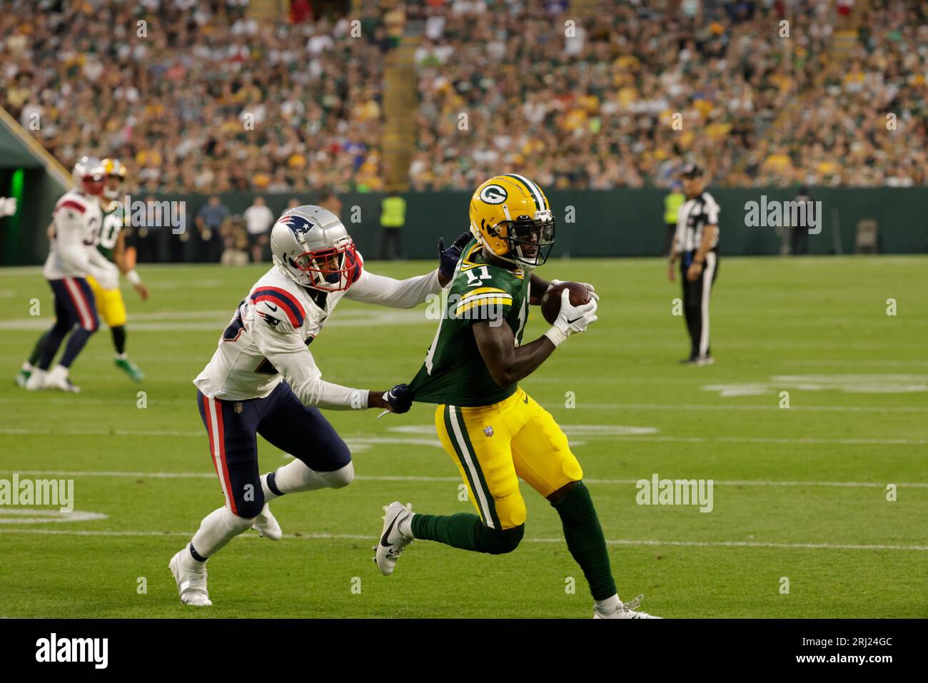 Green Bay Packers wide receiver Jayden Reed scores on a pass as New England  Patriots cornerback Shaun Wade defends during a preseason NFL football game  Saturday, Aug. 19, 2023, in Green Bay,