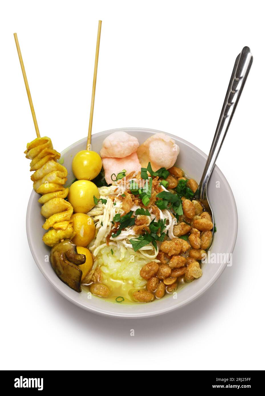 Bubur ayam, an Indonesian porridge dish. breakfast staple isolated on white background. Stock Photo