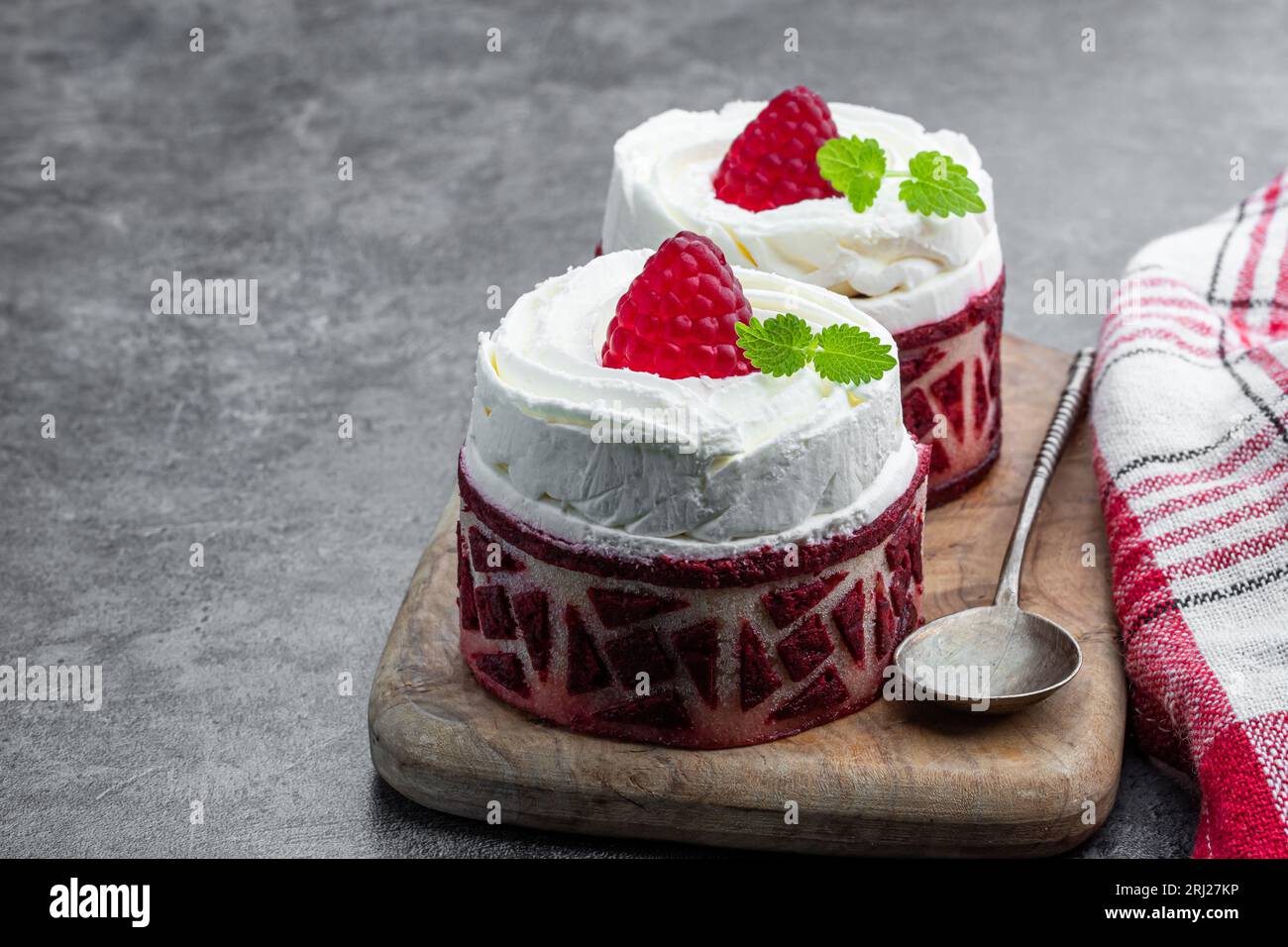 Red velvet  mini cakes with whipped cream on gray background Stock Photo