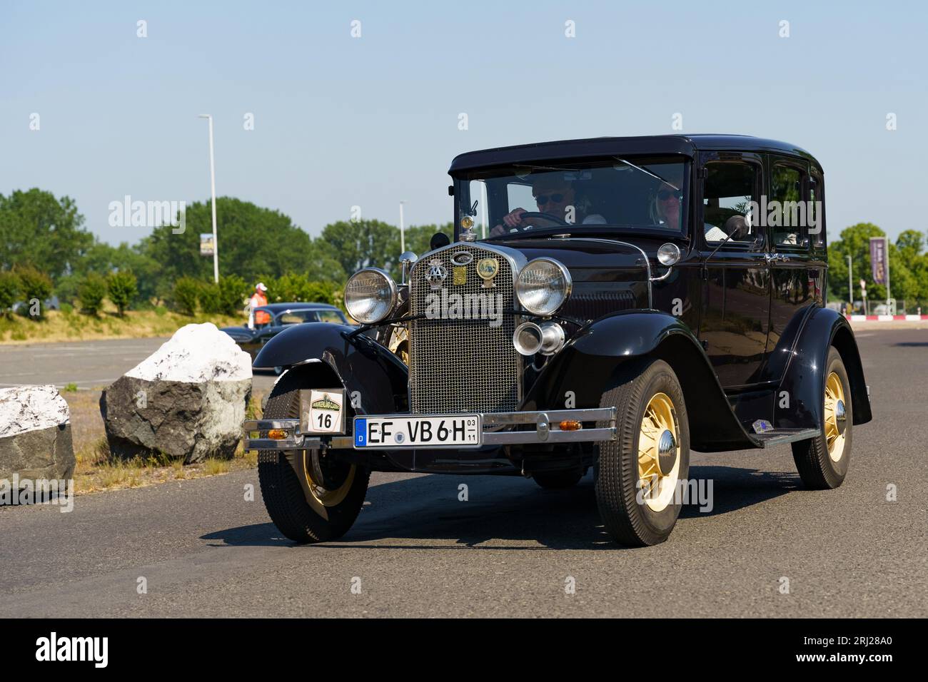 Waltershausen, Germany - June 10, 2023: Ford Model A driving down a city street. body parts, car wheel. Stock Photo