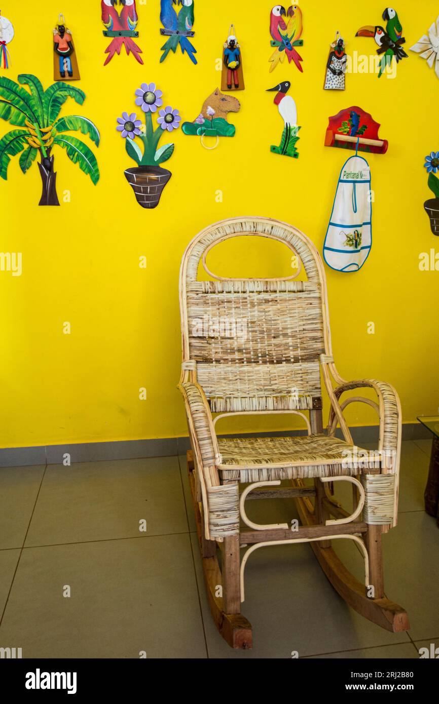 Rocking chair and colorful wall art at a Souvenir or gift shop in Mato