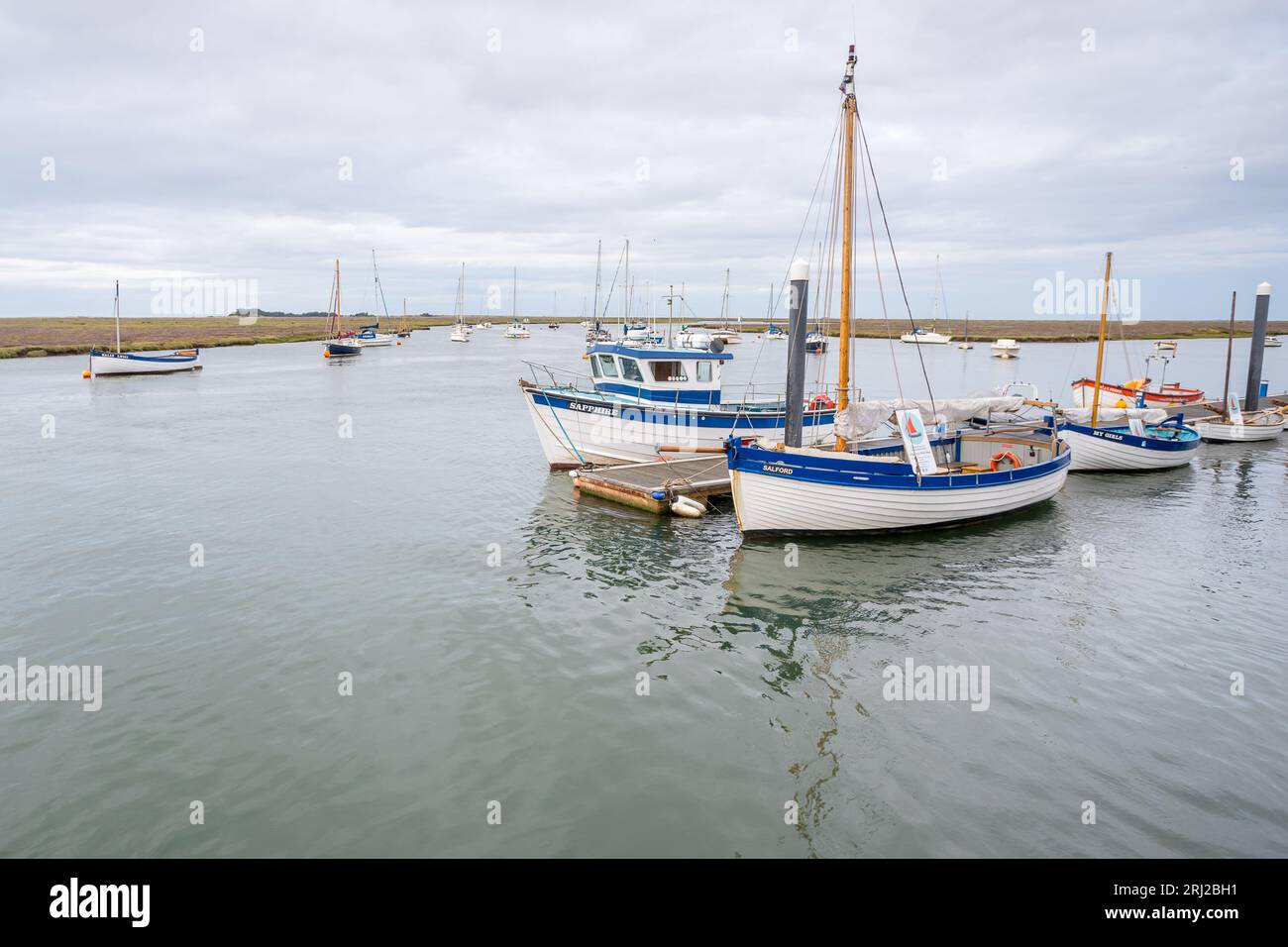 Boats fill the frame at high tide in the harbour at Wells next the Sea