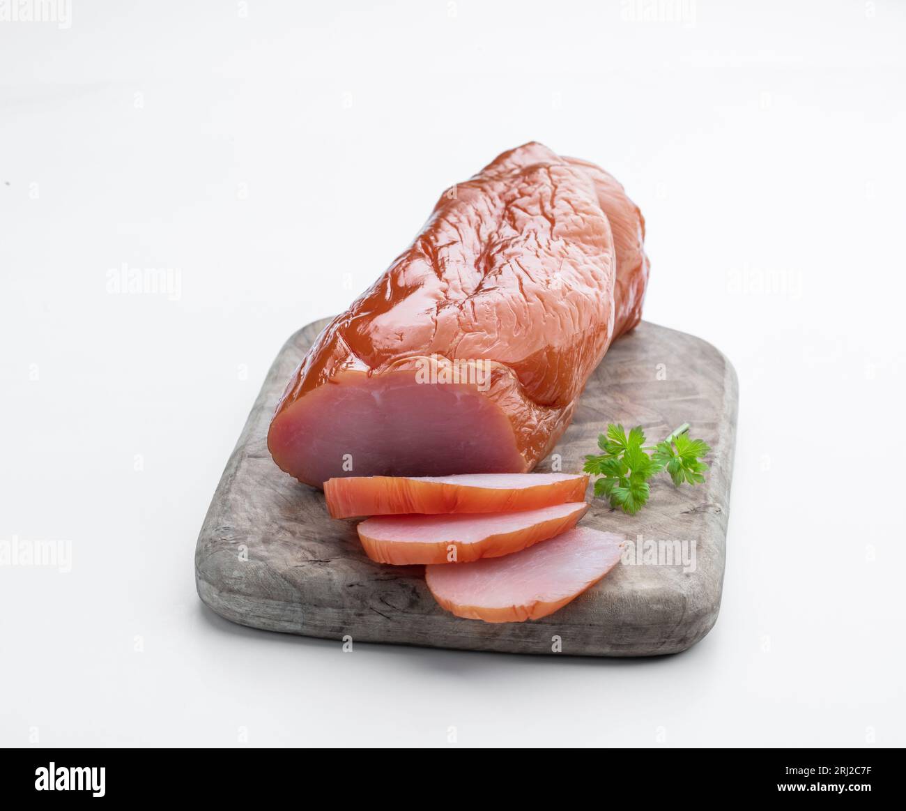 Dried  chicken breast on wooden board isolated on white Stock Photo