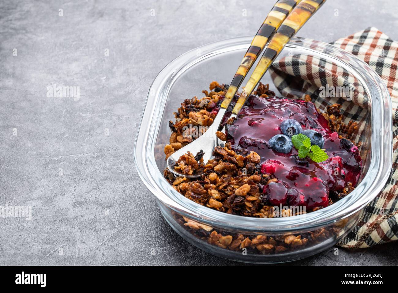 Blueberry  crisp baked oatmeal on gray background Stock Photo