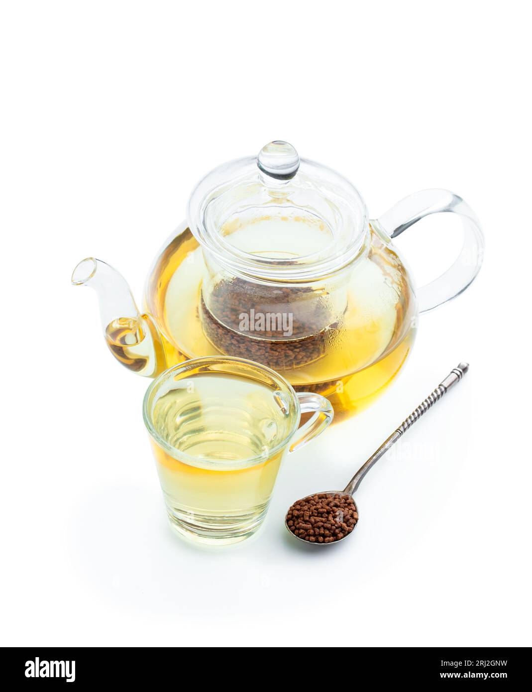Buckwheat  tea in transparent teapot isolated on white Stock Photo