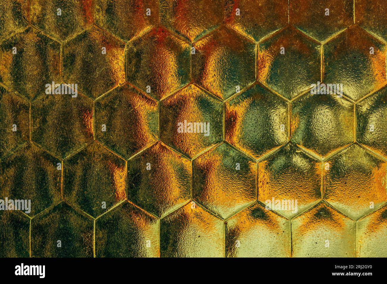 Old dirty yellow hex textured glass surface as background and design element Stock Photo