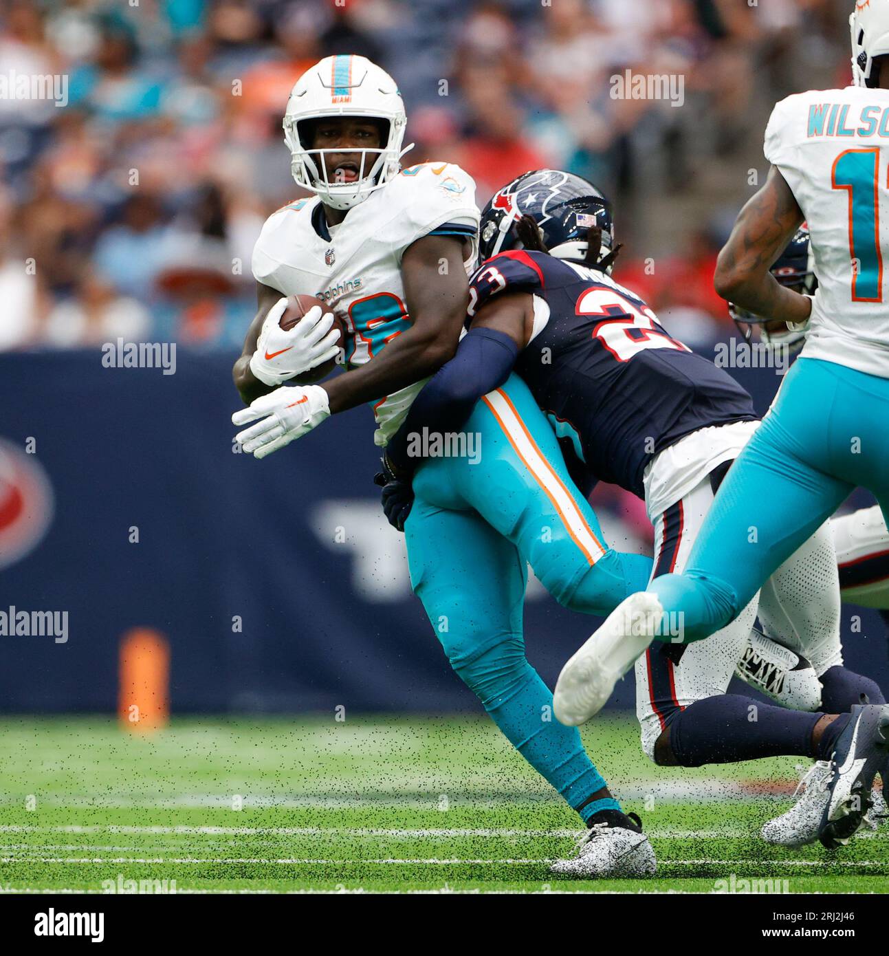 August 19, 2023: Houston Texans safety Eric Murray (23) tackles Miami  Dolphins running back De'Von Achane (28) during an NFL preseason game  between the Texans and the Dolphins Jaguars on August 19,