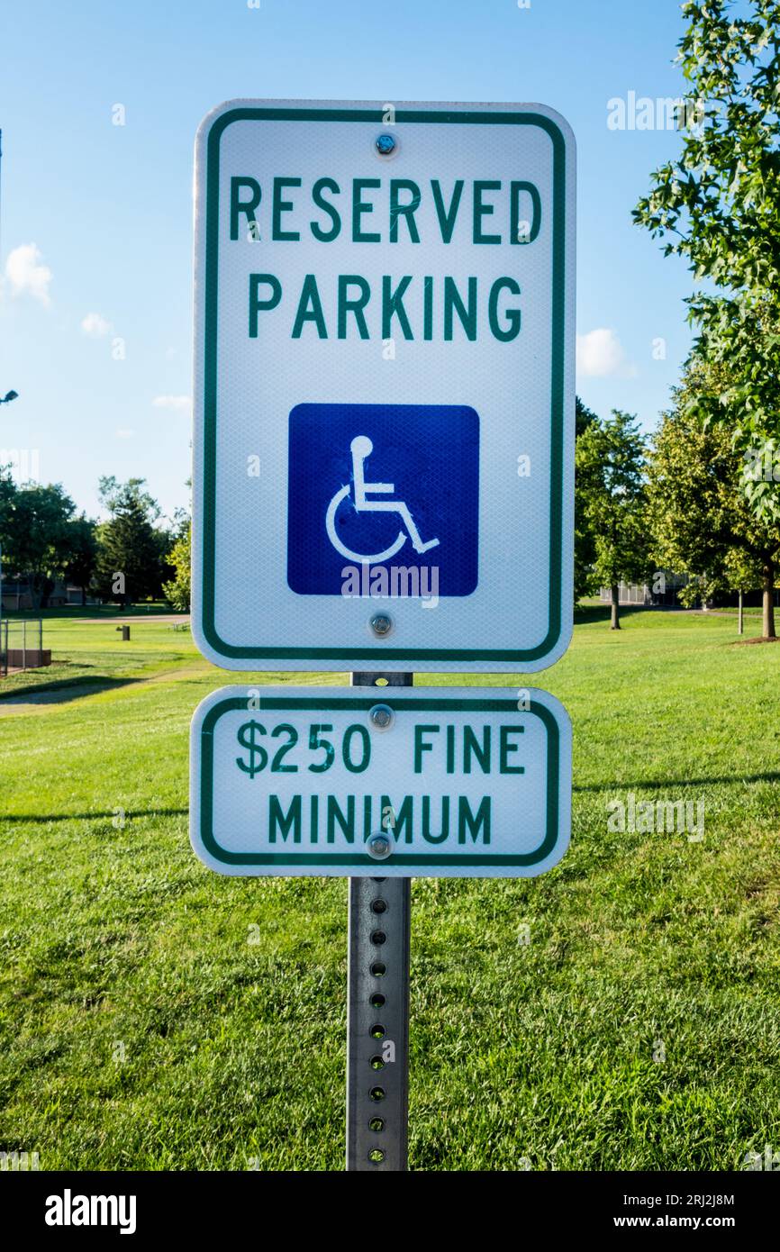 Reserved Parking for disabled or handicapped person. A 250 minimum fine to deter improper use