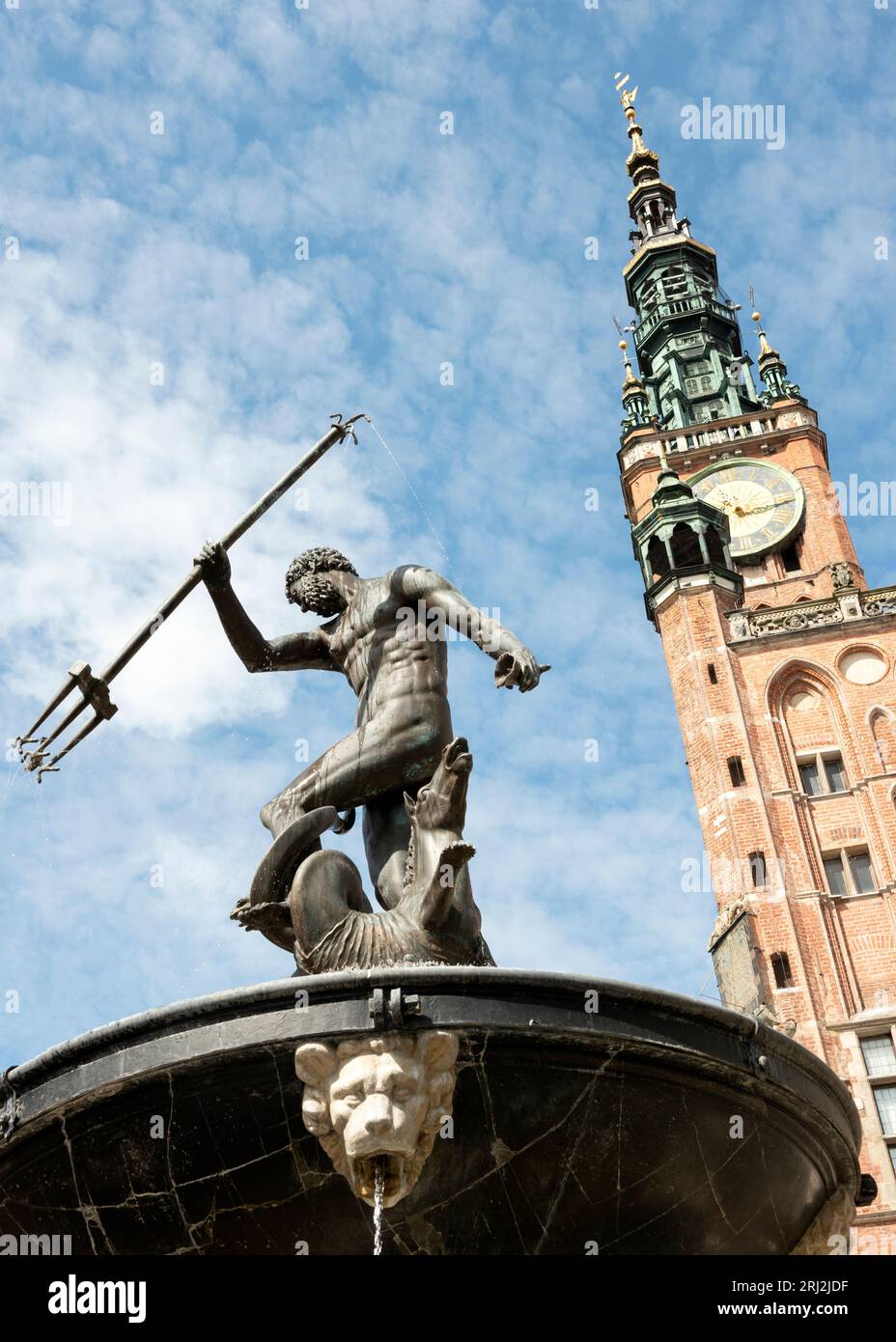 Neptune's fountain statue and The Main Town Hall in Dlugi Targ, Old Town of Gdansk, Poland, Europe, EU Stock Photo