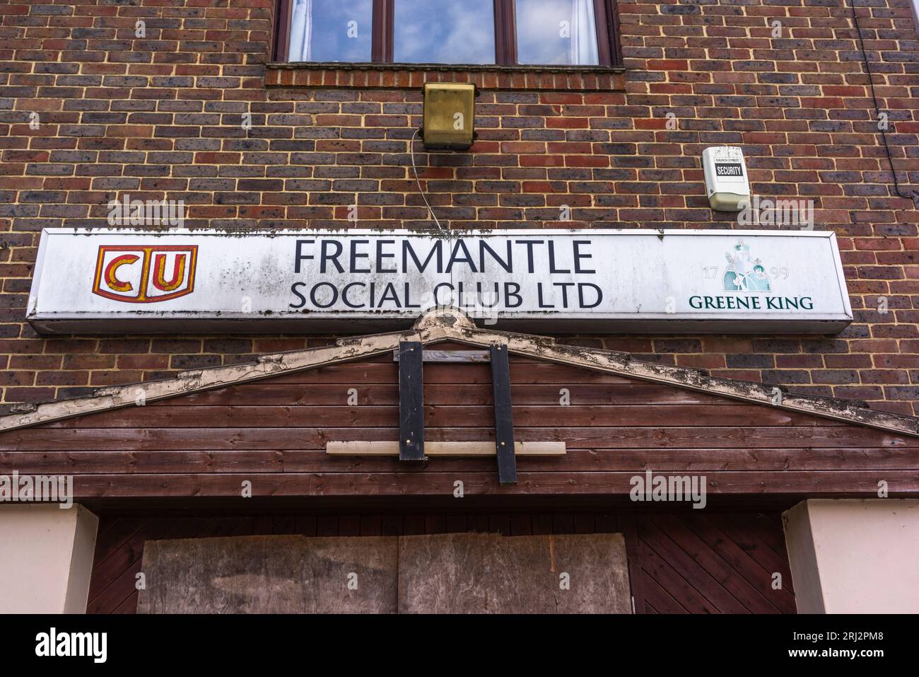 Weathered sign outside of a closed down social club in Southampton, England, UK Stock Photo