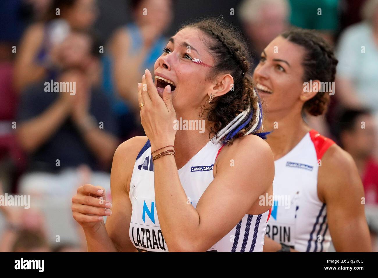 Auriana LazraqKhlass, of France, reacts watching the results after the