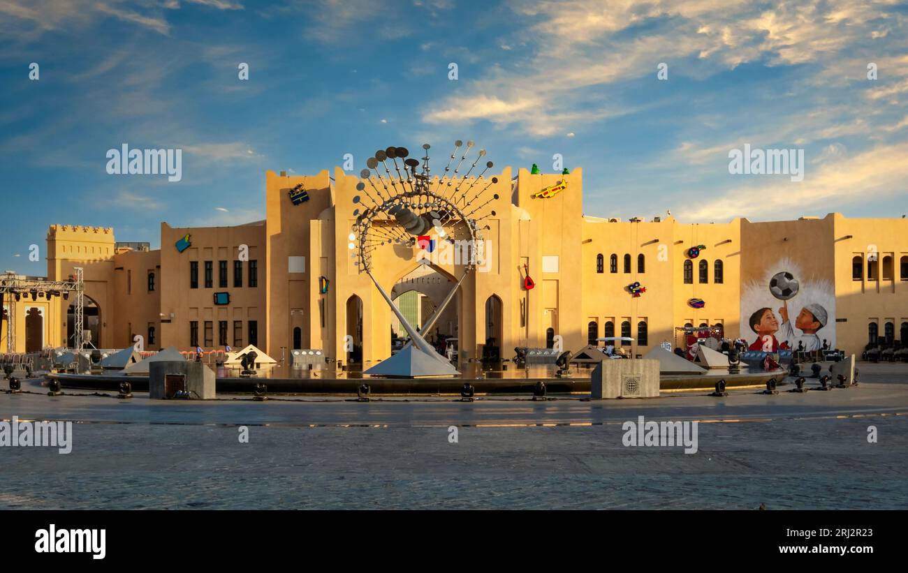 Captured during Qatar's FIFA World Cup 2022, a captivating photo showcases the enchanting Katara Cultural Village fan zone. Bathed in the warm hues of Stock Photo