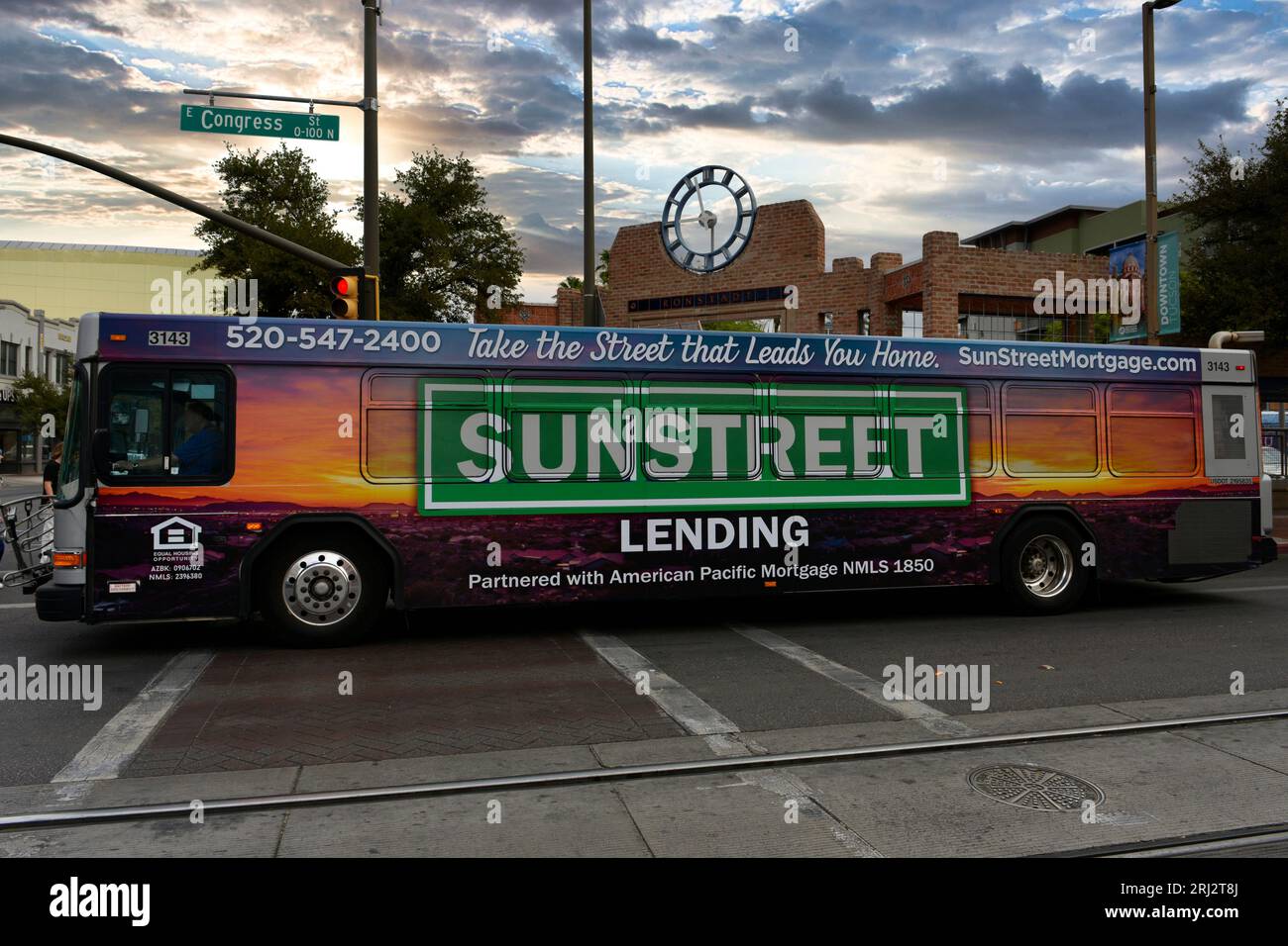 Public transport in Tucson AZ with colorful advertising wrap covering the sides and back. Stock Photo