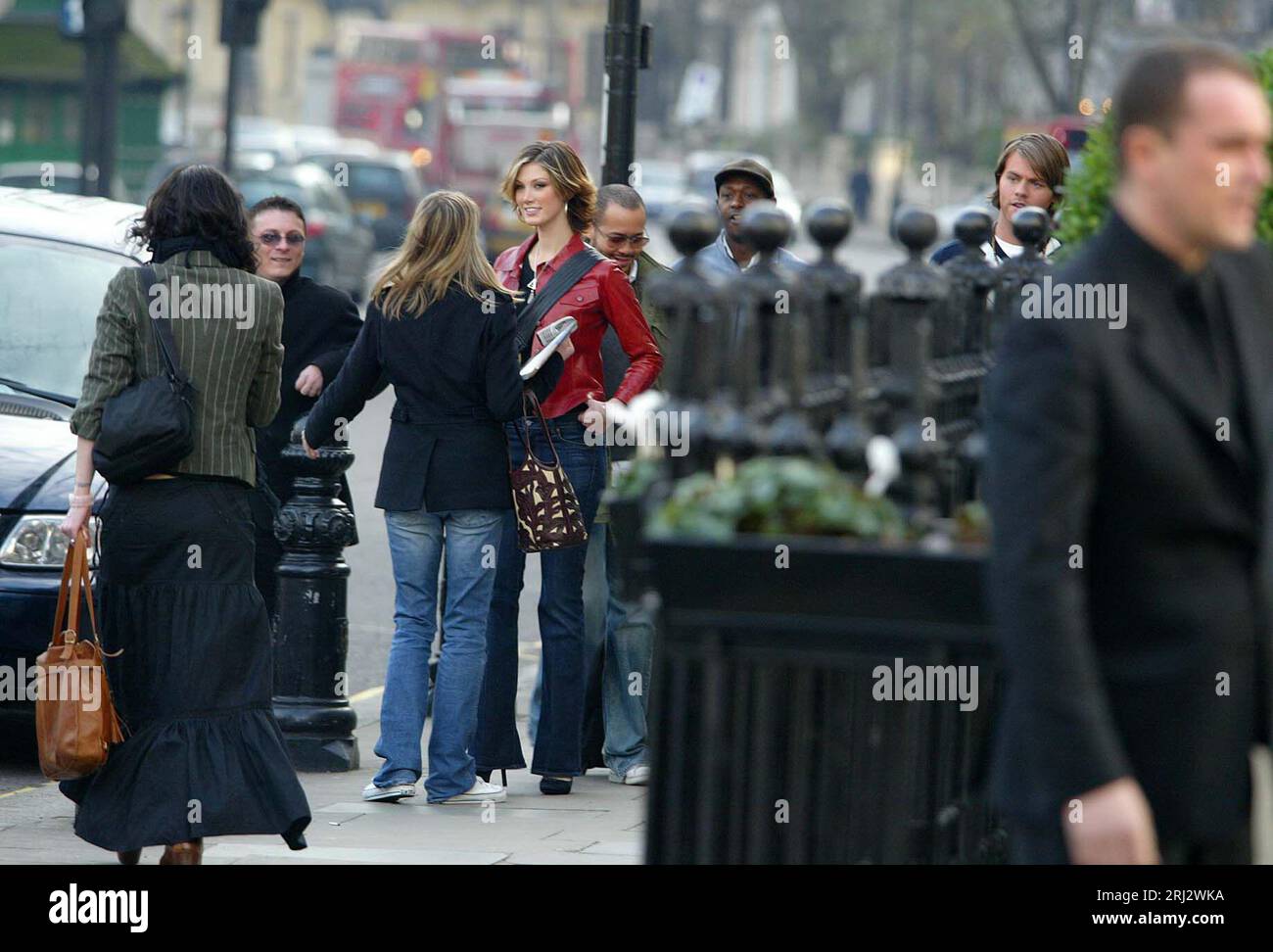 Delta Goodrem leaving her hotel in London with former Westlife musician Brian Mcfadden's (Far Right) Picture James Boardman. Stock Photo
