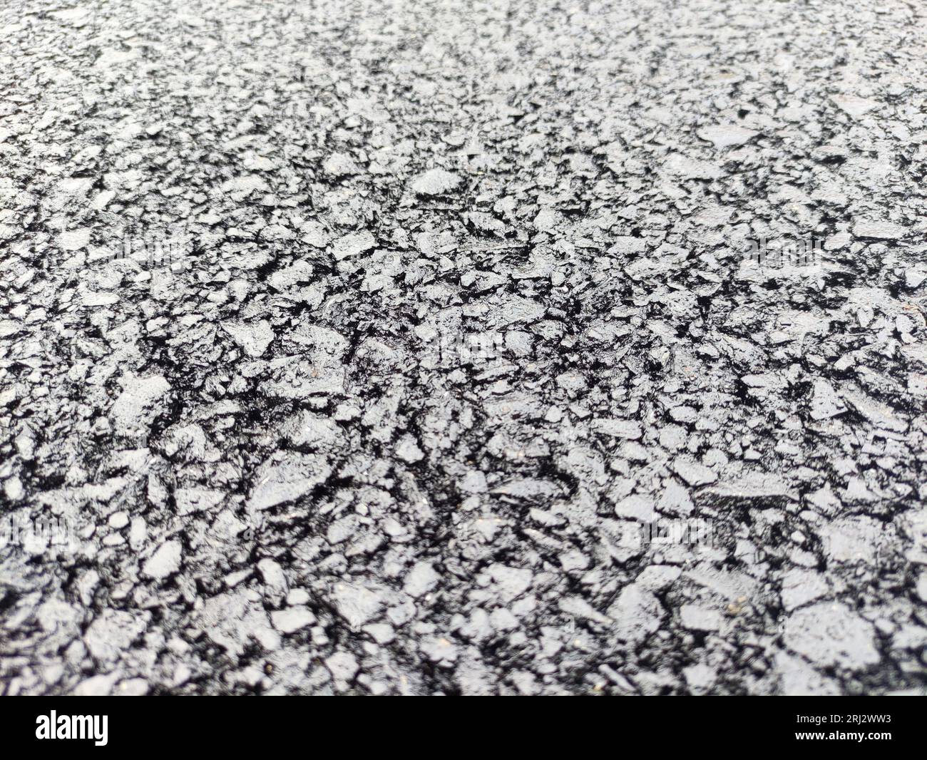 Asphalt road background, close view. Highway pavement texture macro