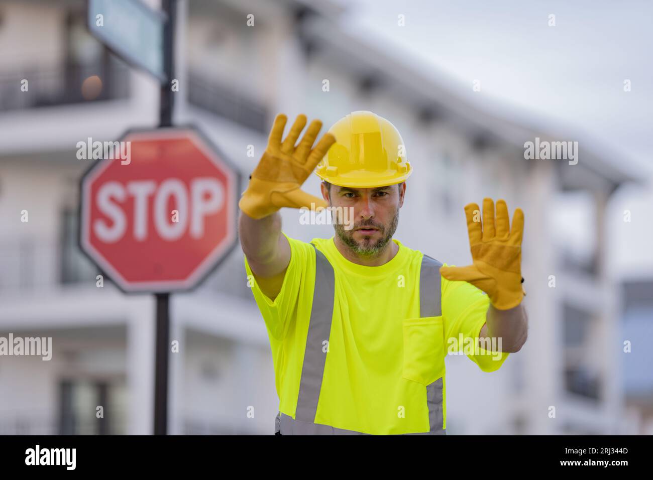 Stop Buildign Sign Stop road sign. Builder with stop gesture, no hand, dangerous on ...