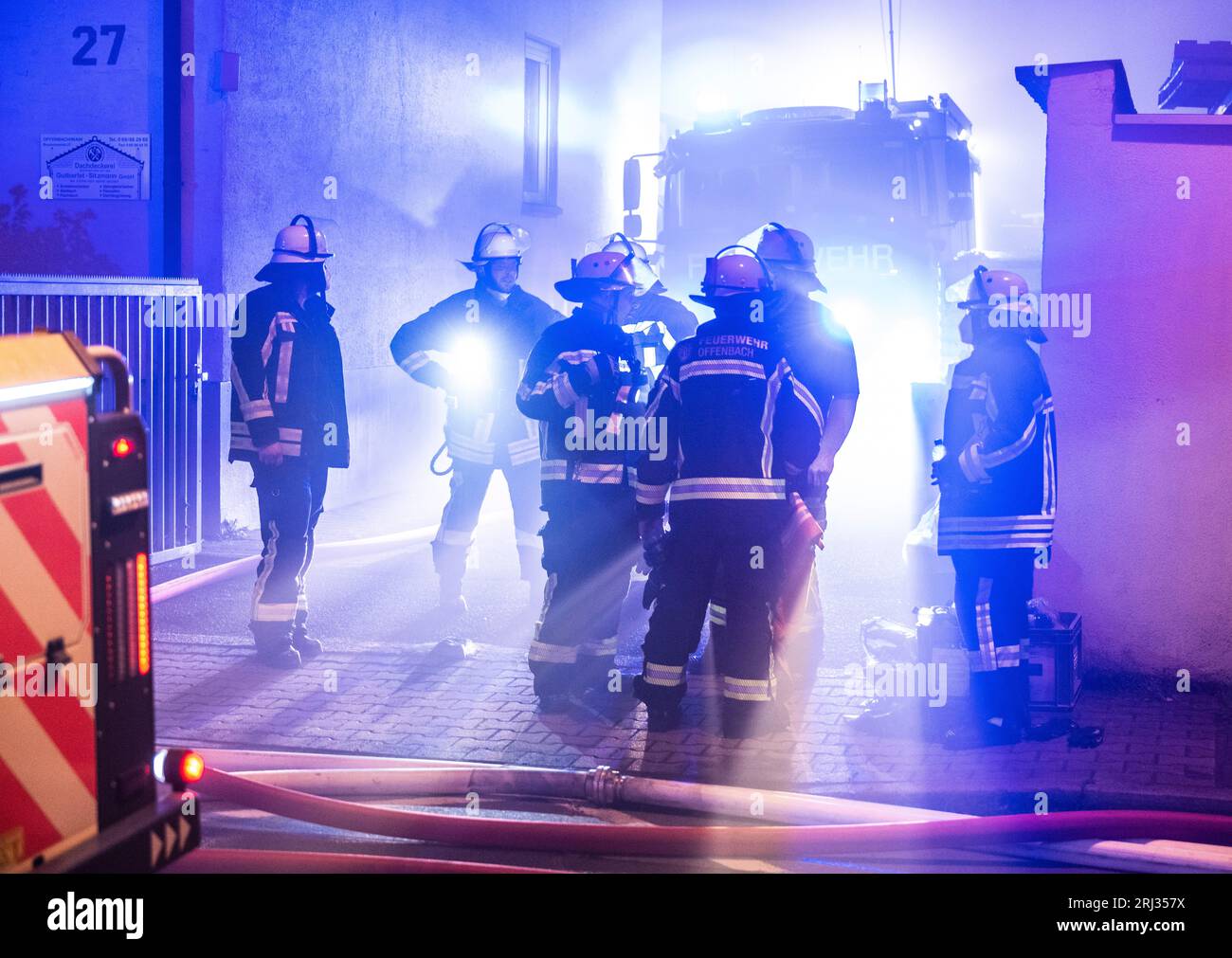 Offenbach, Germany. 20th Aug, 2023. Firefighters fight a fire at a
