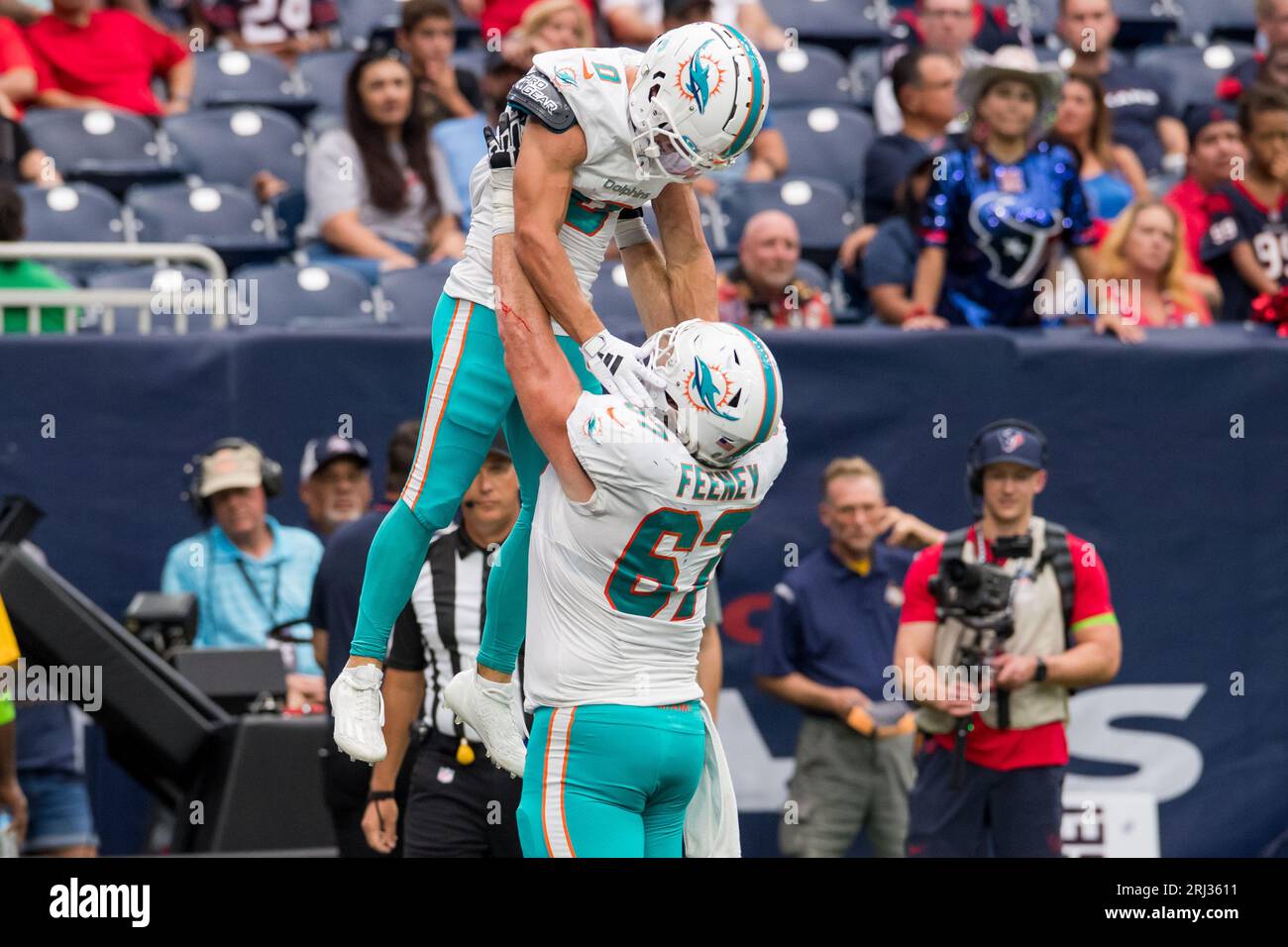 August 19, 2023: Miami Dolphins wide receiver Braxton Berrios (0) celebrates his touchdown with Miami Dolphins guard Dan Feeney (67) during a preseason game between the Miami Dolphins and the Houston Texans in Houston, TX. Trask Smith/CSM Stock Photo