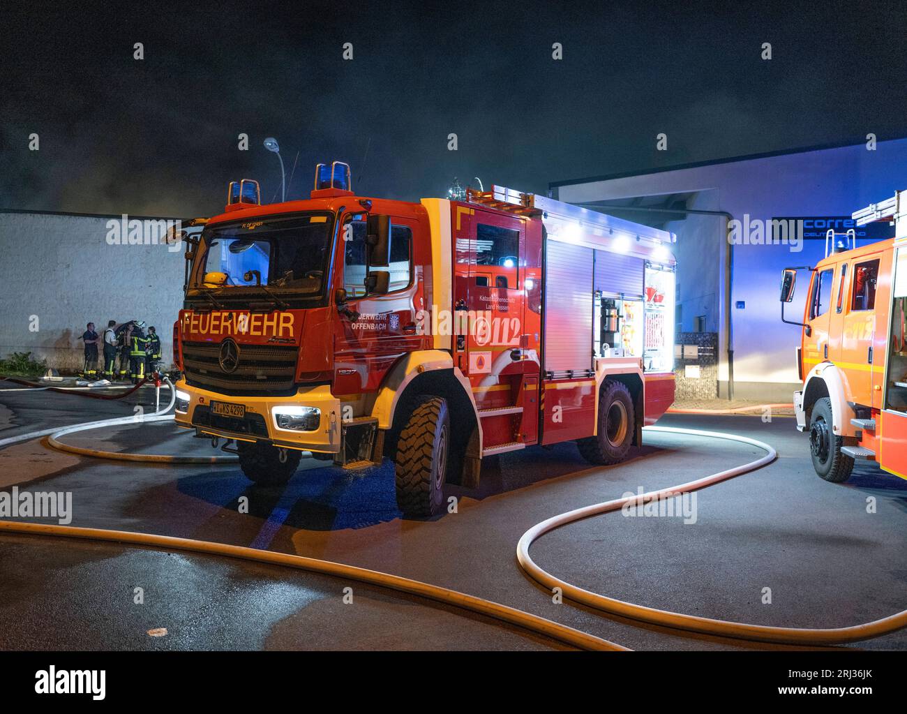 Offenbach, Germany. 20th Aug, 2023. Firefighters fight a fire at a