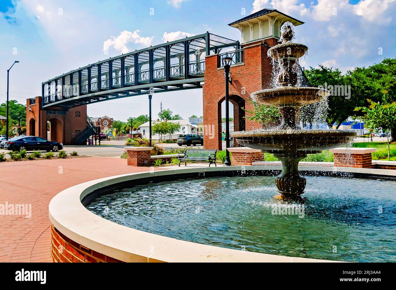 The pedestrian bridge and water fountain are pictured at John B. Foley