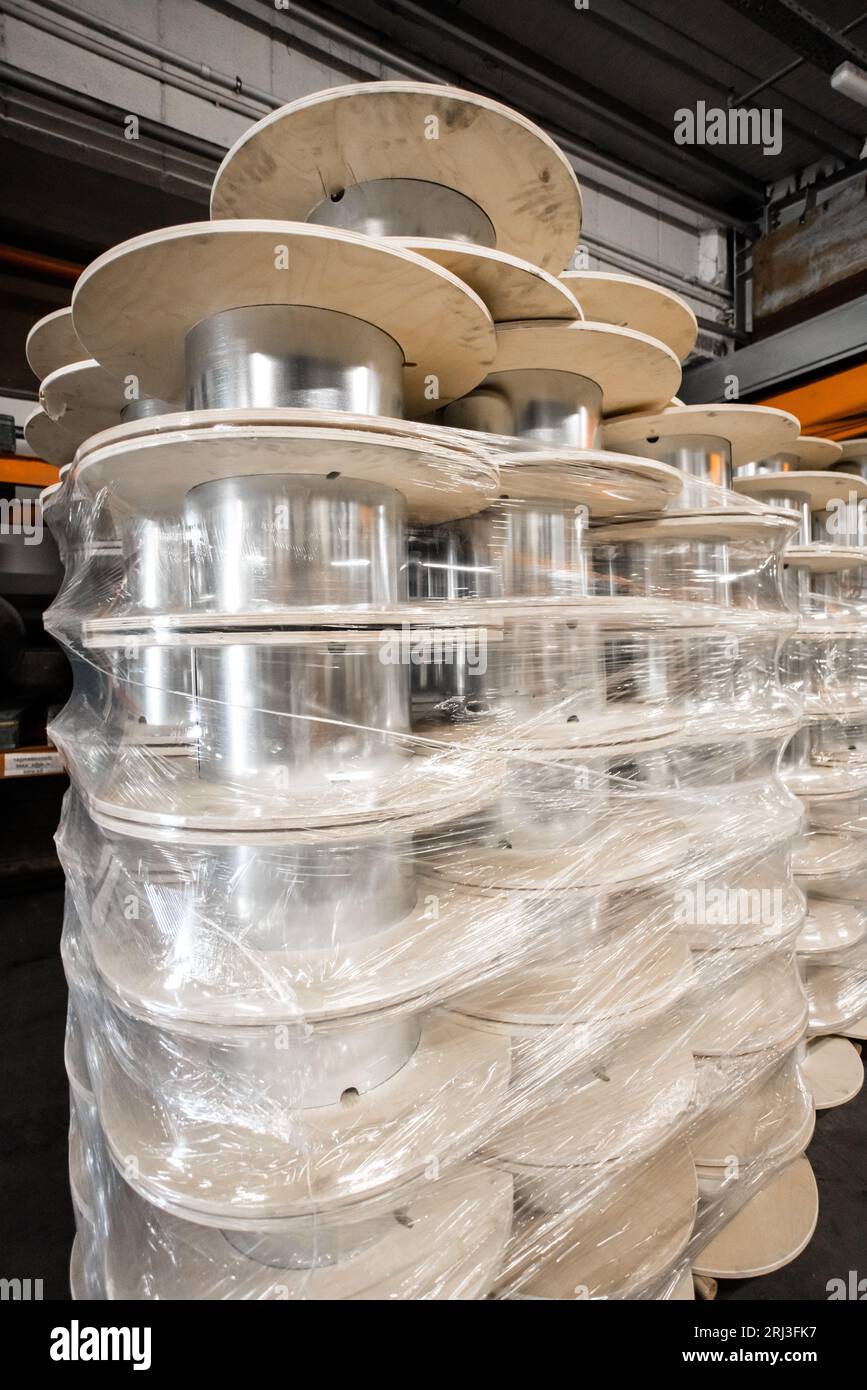 A closeup of a large stack of white rolls located in a factory Stock ...