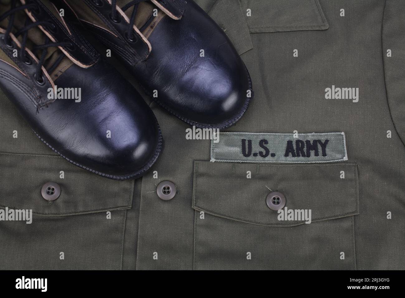 U.S. Army olive green uniform with boots background Stock Photo Alamy