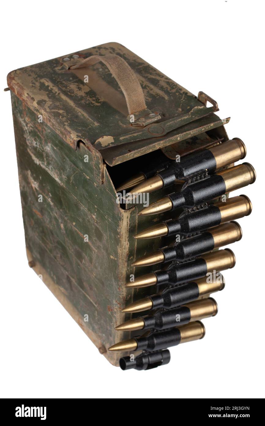 Ammo box with ammunition belt and 14.5mm cartridges for a 14.5mm KPVT heavy machine gun used by the former Soviet Union. Isolated on white background. Stock Photo