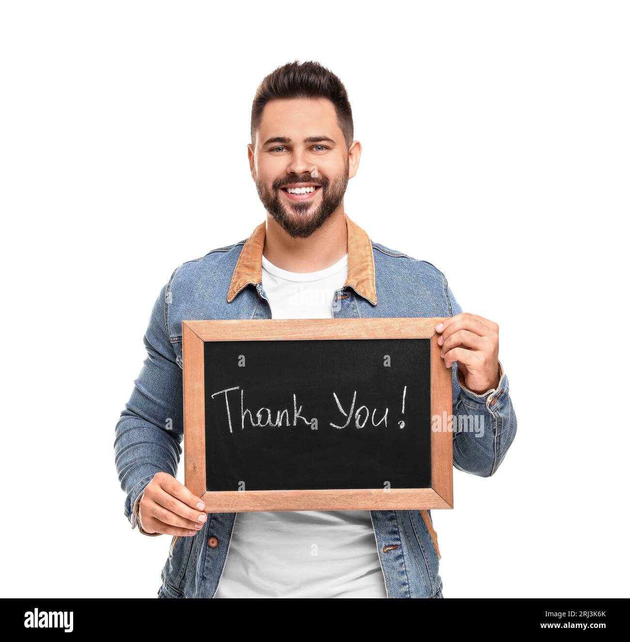 Happy man holding small chalkboard with phrase Thank You on white ...