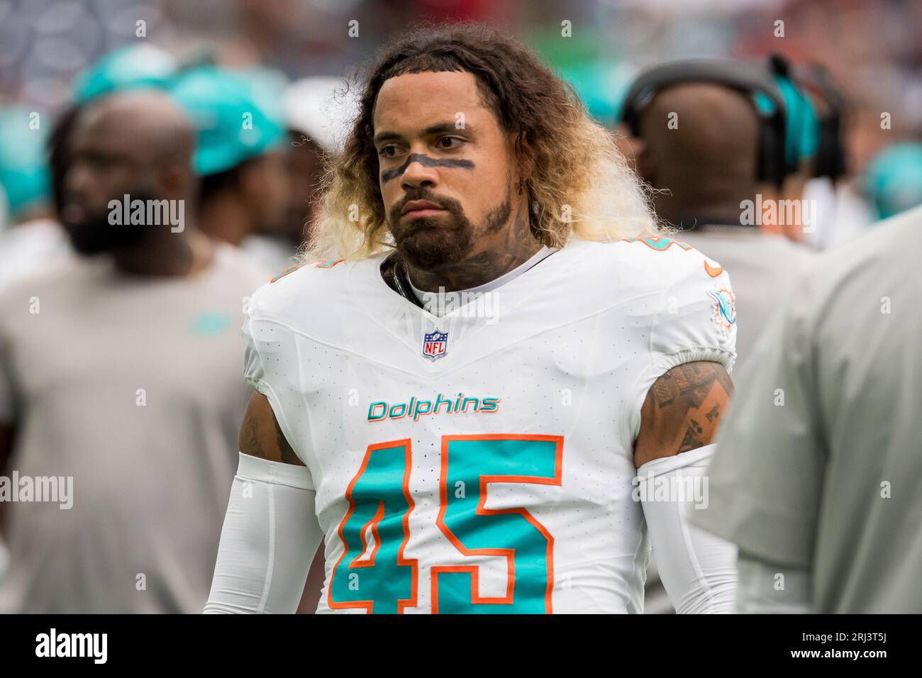 Miami Dolphins linebacker Duke Riley (45) smiles as he signs autographs for  fans in the stands before an NFL football game against the Houston Texans,  Sunday, Nov. 27, 2022, in Miami Gardens