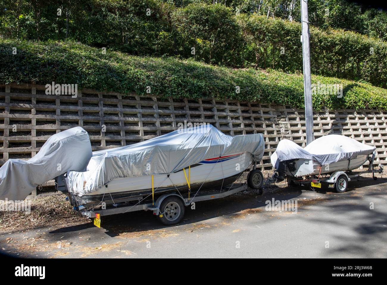 Trailer boat parked on a Sydney street with protective cover over the