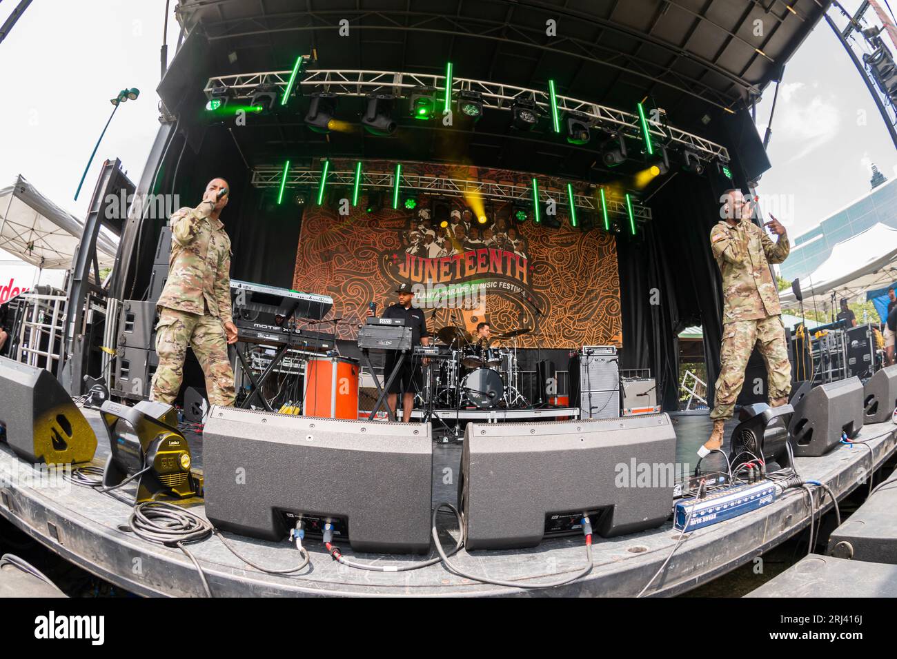 Atlanta, GA / USA – June 17, 2023:  U.S. Army rappers perform hip hop music wearing their fatigues at the Juneteenth Festival in Atlanta, GA. Stock Photo
