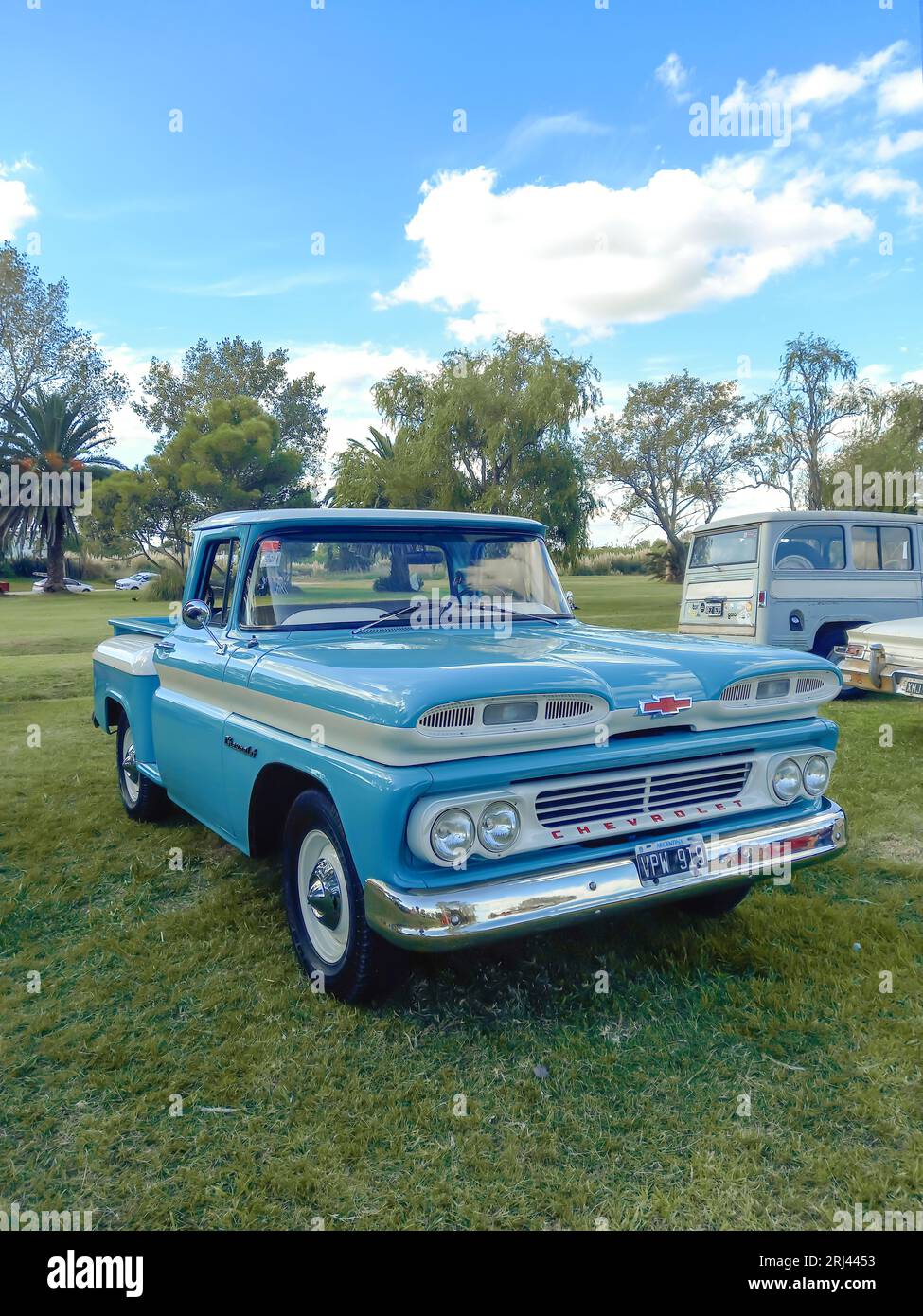 Old light blue Chevrolet Chevy C10 Apache pickup truck early 1960s in the countryside. CAACMACH 2023 classic car show. Sunny day Stock Photo