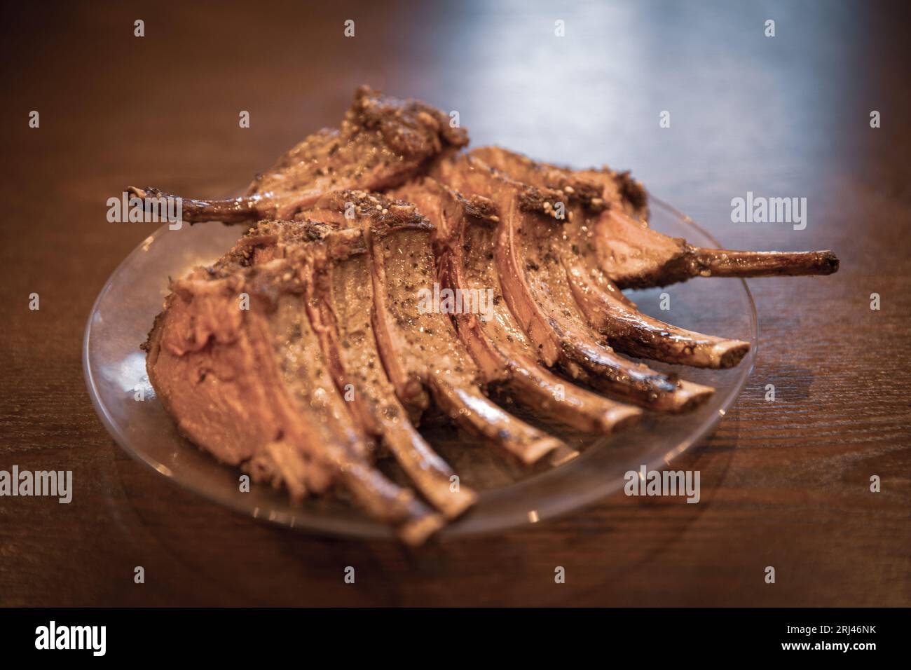 Frenched rack of lamb on a served on a plate Stock Photo