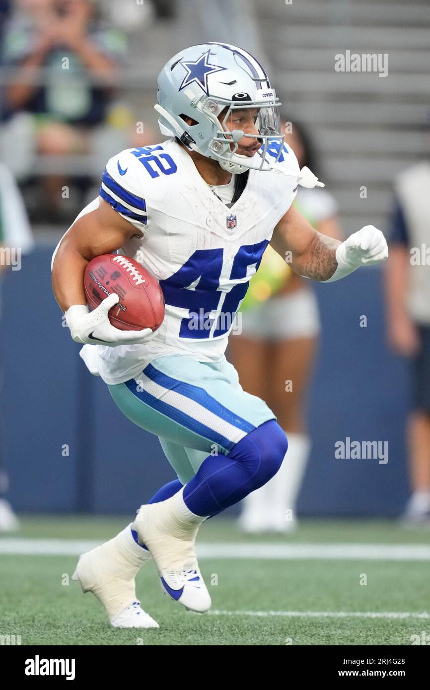 Dallas Cowboys running back Deuce Vaughn (42) runs with the ball during an  NFL pre-season football game against the Seattle Seahawks, Saturday, Aug.  19, 2023 in Seattle. (AP Photo/Ben VanHouten Stock Photo 