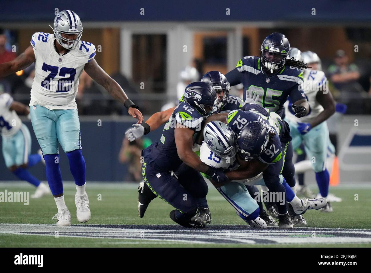 Seattle Seahawks linebacker Tyreke Smith (92) sacks Dallas Cowboys  quarterback Will Grier (15) during an NFL pre-season football game,  Saturday, Aug. 19, 2023 in Seattle. (AP Photo/Ben VanHouten Stock Photo -  Alamy